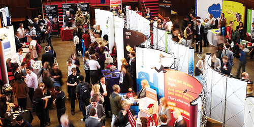 A busy scene as students visit the different stands at a graduate recruitment fair.
